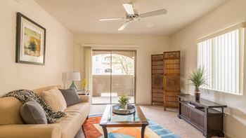 Desert Sands living room with ceiling fan. 